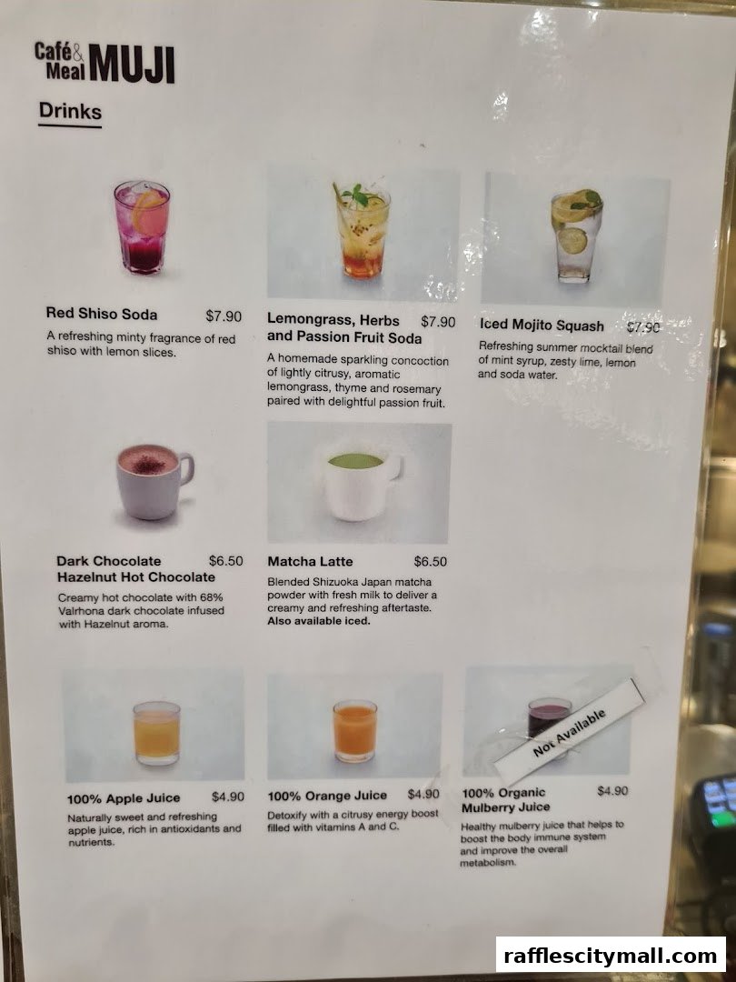 A menu featuring various drinks including sodas, hot chocolate, matcha latte, and juices.