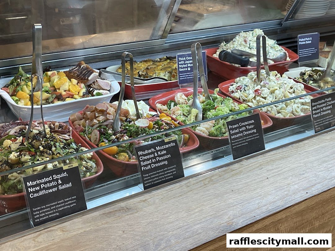 A display of various fresh salads and prepared dishes in a refrigerated case.