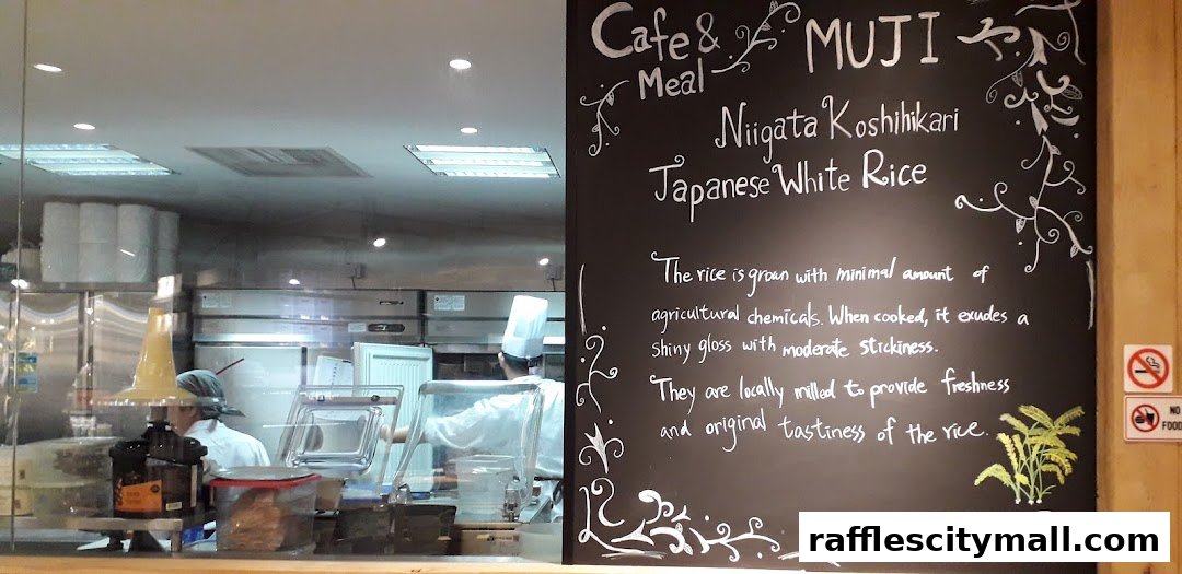 A chalkboard menu at Cafe & Meal MUJI Raffles City highlights Japanese White Rice.