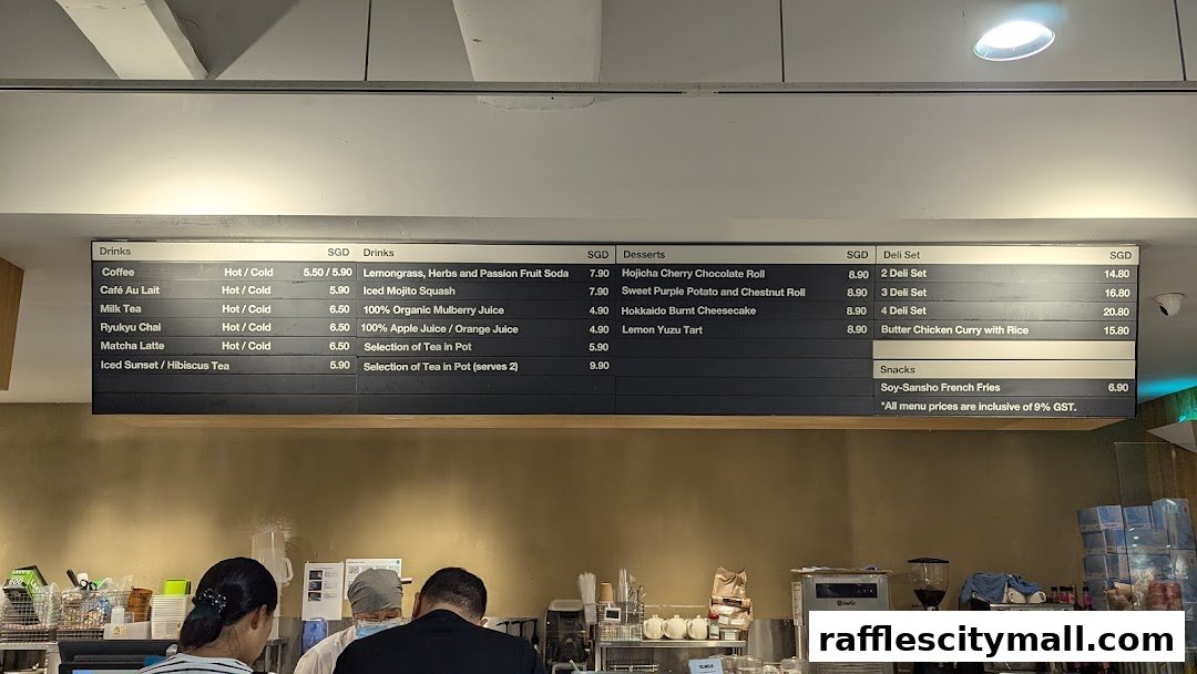 A menu board displaying drinks, desserts, deli sets, and snacks with prices.