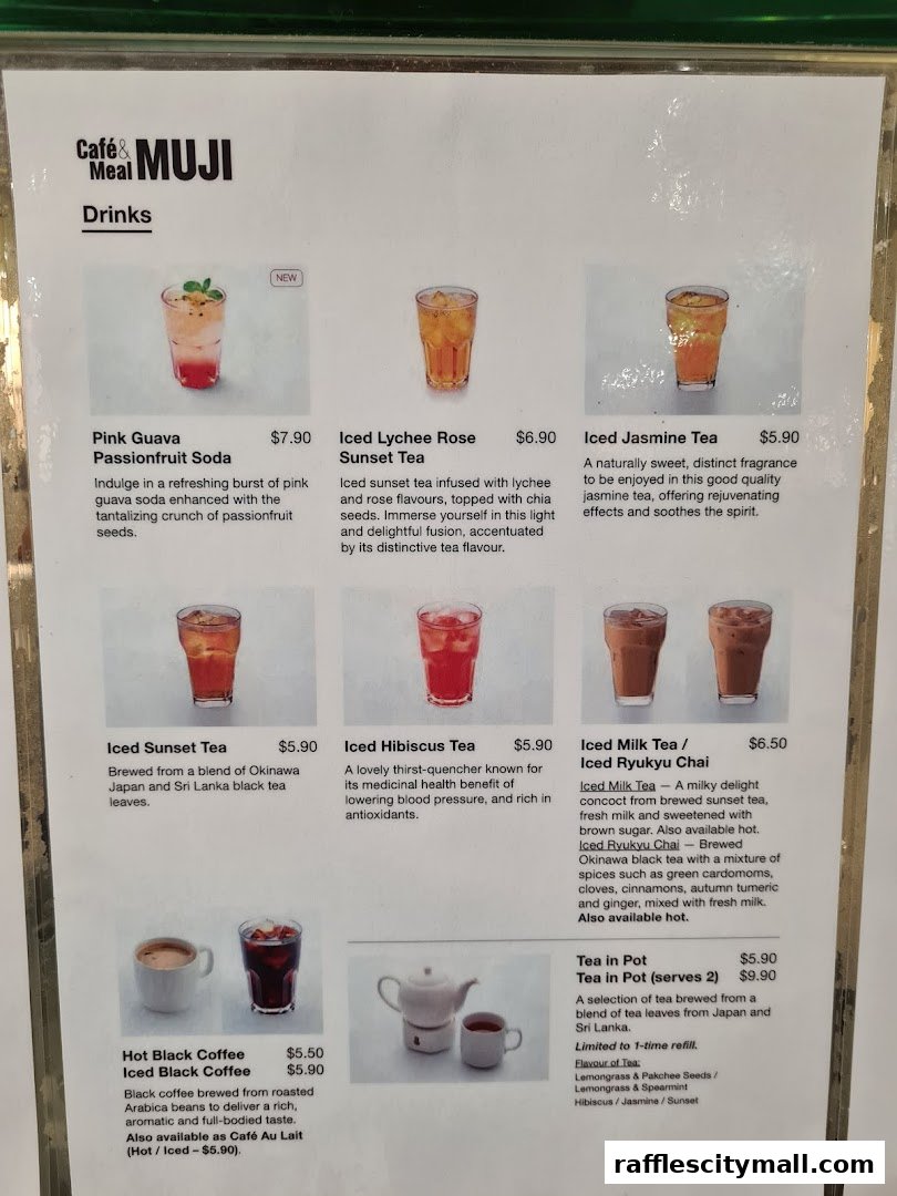 A menu displaying various drinks offered at Cafe&Meal MUJI, including sodas, teas, and coffees.