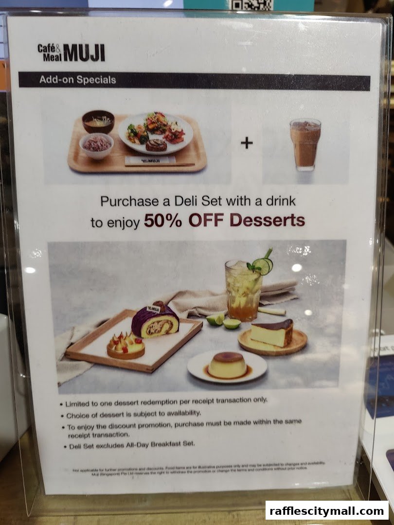 A promotional sign for Cafe MUJI offering 50% off desserts with a deli set purchase.