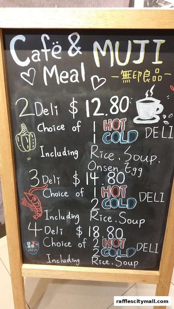 A chalkboard menu for Cafe & MUJI Meal, detailing deli set options and prices.