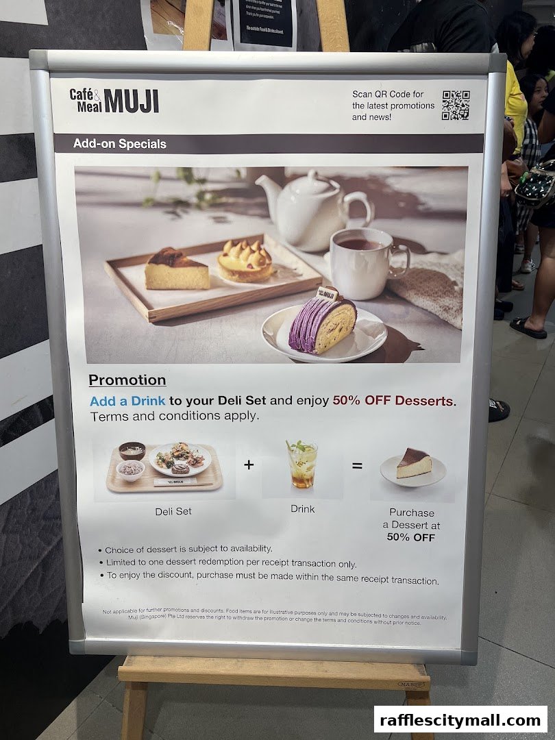 A promotional poster for CafeMeal MUJI offering 50% off desserts with a deli set and drink purchase.