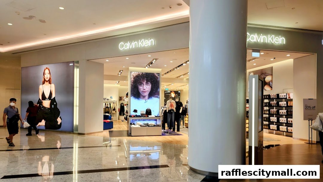 The Calvin Klein store features large displays with models and clothing, showcasing the brand's latest collection.