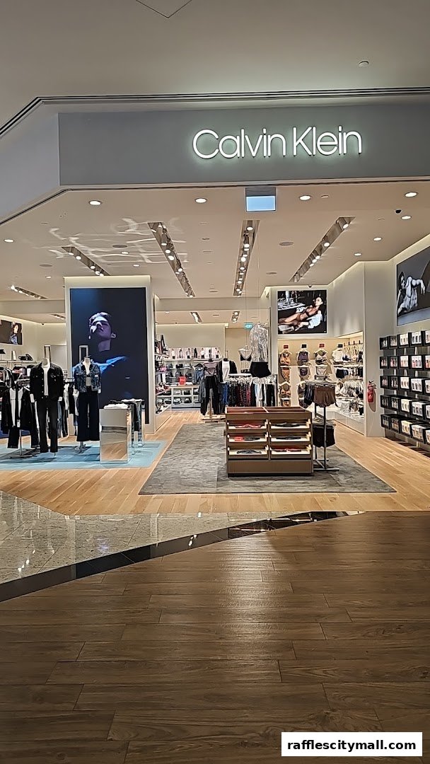 The interior of a Calvin Klein store showcasing clothing and accessories on display.