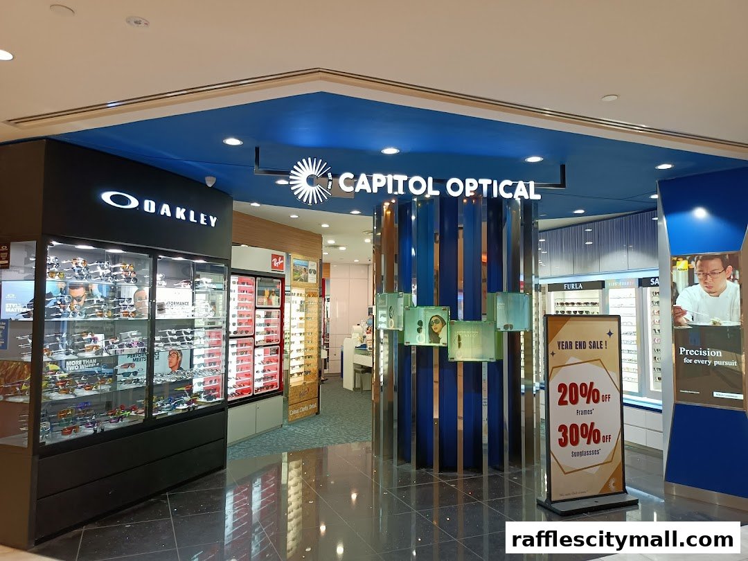 The entrance of Capitol Optical, showcasing Oakley sunglasses and a year-end sale.