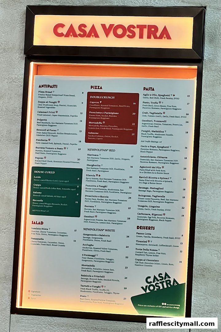 A brightly lit menu board for Casa Vostra, showcasing Italian dishes with prices.