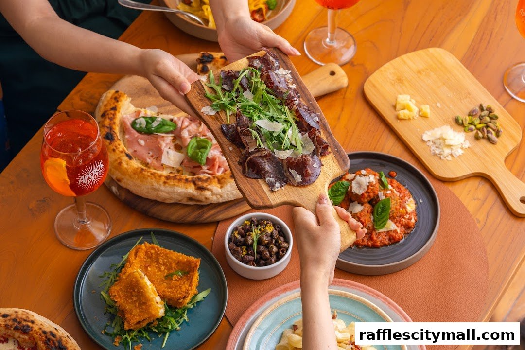 A table laden with Italian food, including pizza, cured meats, meatballs, and drinks.