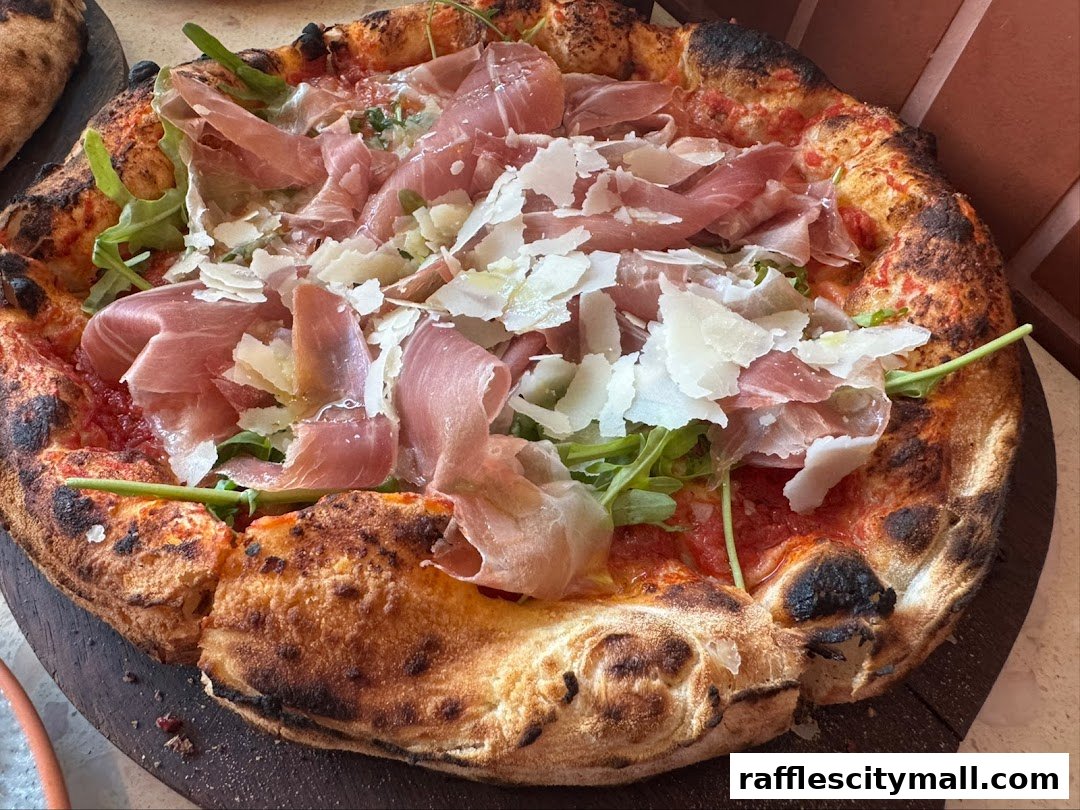 A delicious pizza topped with prosciutto, arugula, and shaved parmesan cheese.
