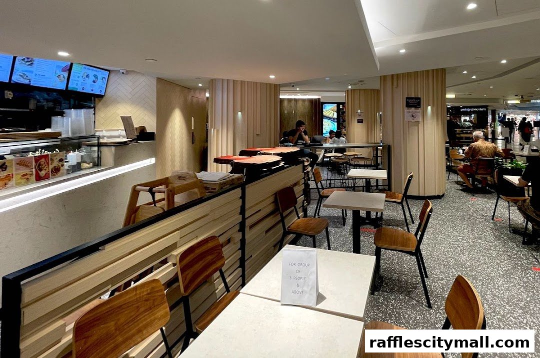 Interior view of Cedele Bakery Kitchen with seating areas and a counter.