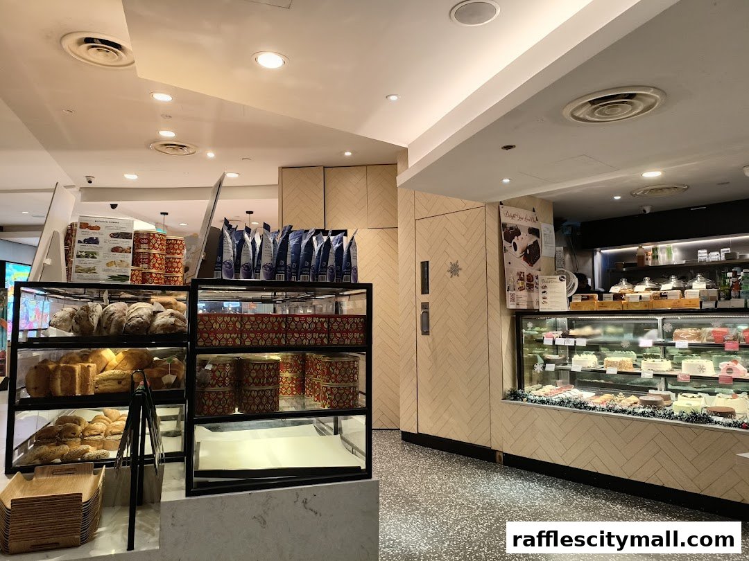 Interior view of Cedele Bakery Kitchen showcasing fresh bread, pastries, and cakes on display.