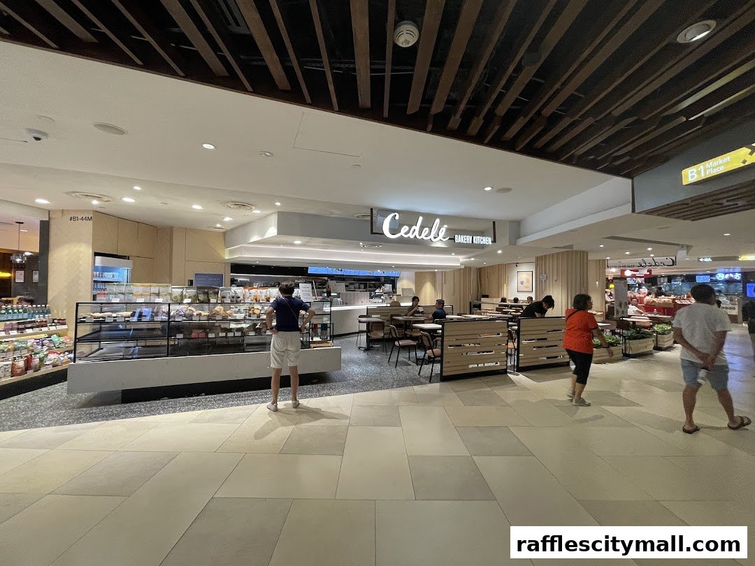 Interior view of Cedele Bakery Kitchen with display cases and seating areas.