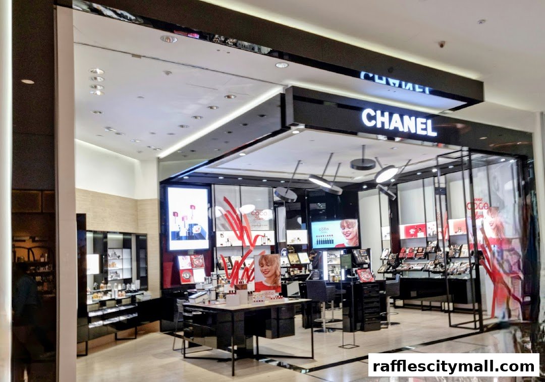 The exterior of a brightly lit Chanel beauty store with makeup displays and advertising.