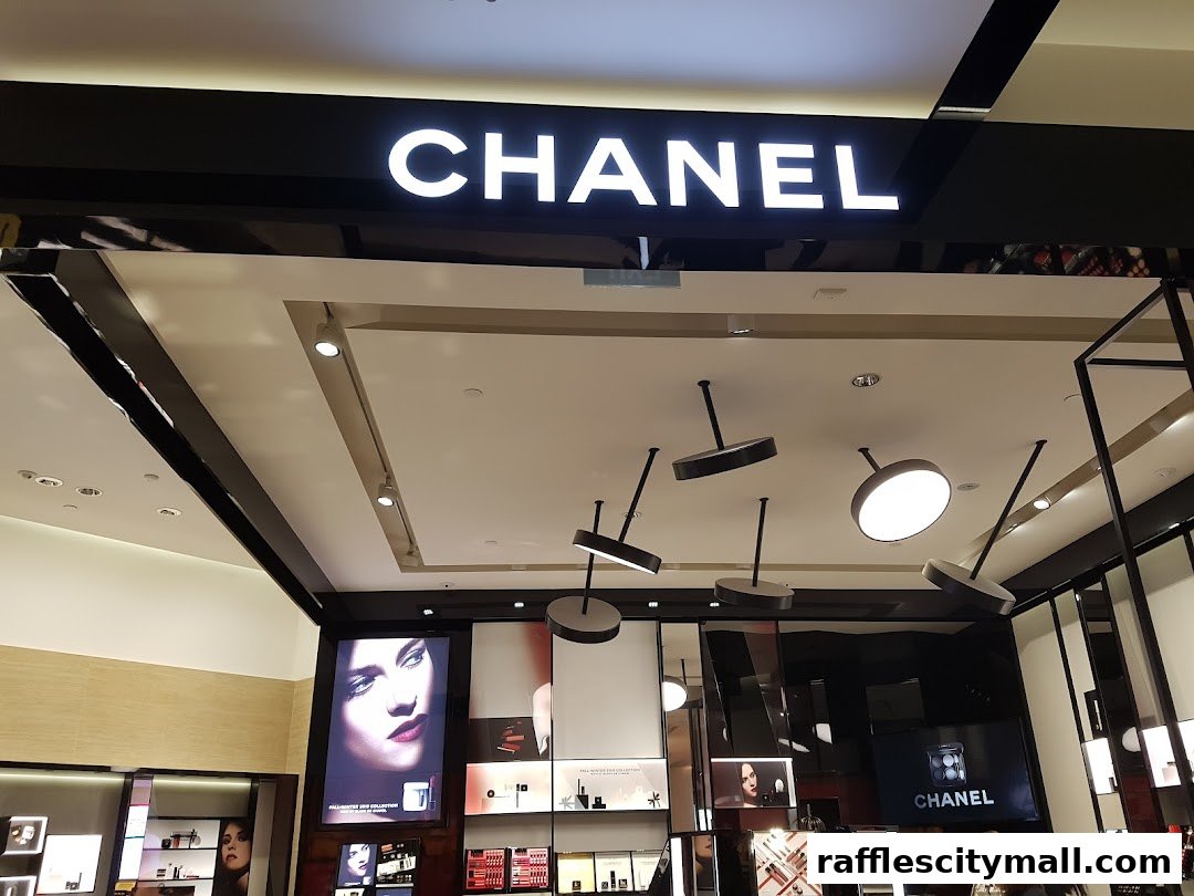 The interior of a brightly lit Chanel store, showcasing makeup and beauty products.