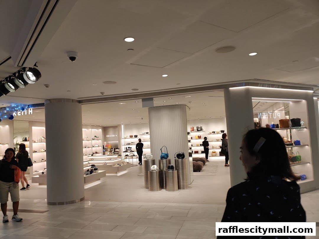 Interior view of a Charles & Keith store showcasing handbags and shoes on display.