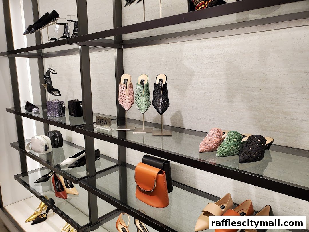 A display of stylish Charles & Keith shoes and handbags on shelves.
