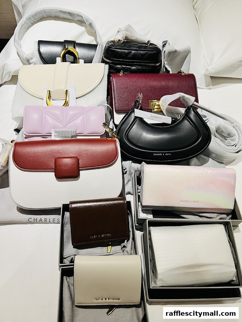 A collection of Charles & Keith handbags and wallets in various colors and styles.