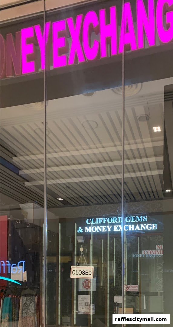 The storefront of Clifford Gems & Money Exchange, currently displaying a 'CLOSED' sign.