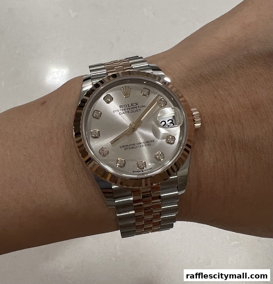 A close-up shot of a Rolex Datejust watch with a diamond-studded dial on a wrist.
