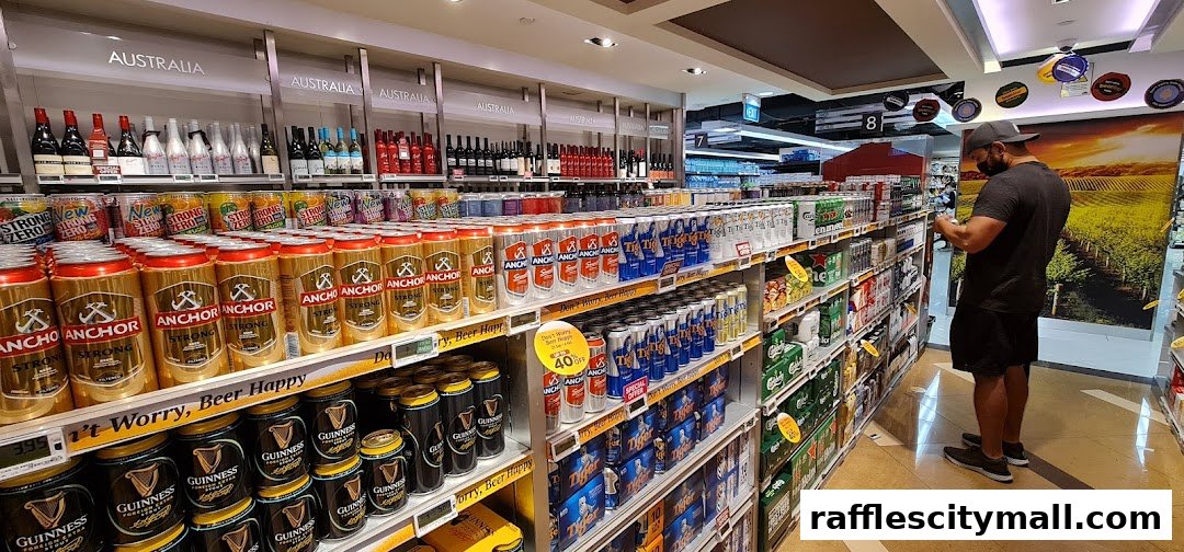 A wide selection of canned and bottled beverages, including beer, displayed on shelves in a retail store.