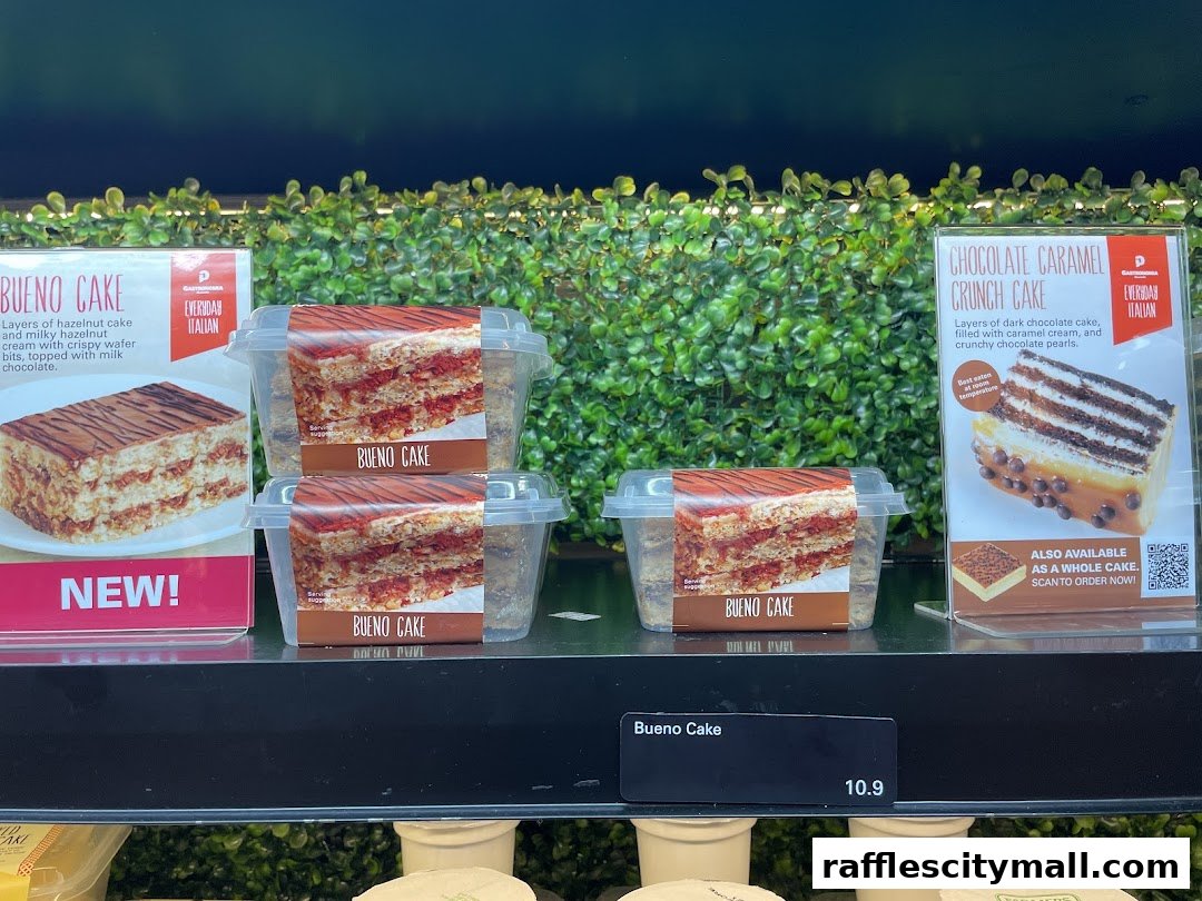 Display of packaged cakes, including Bueno Cake and Chocolate Caramel Crunch Cake.