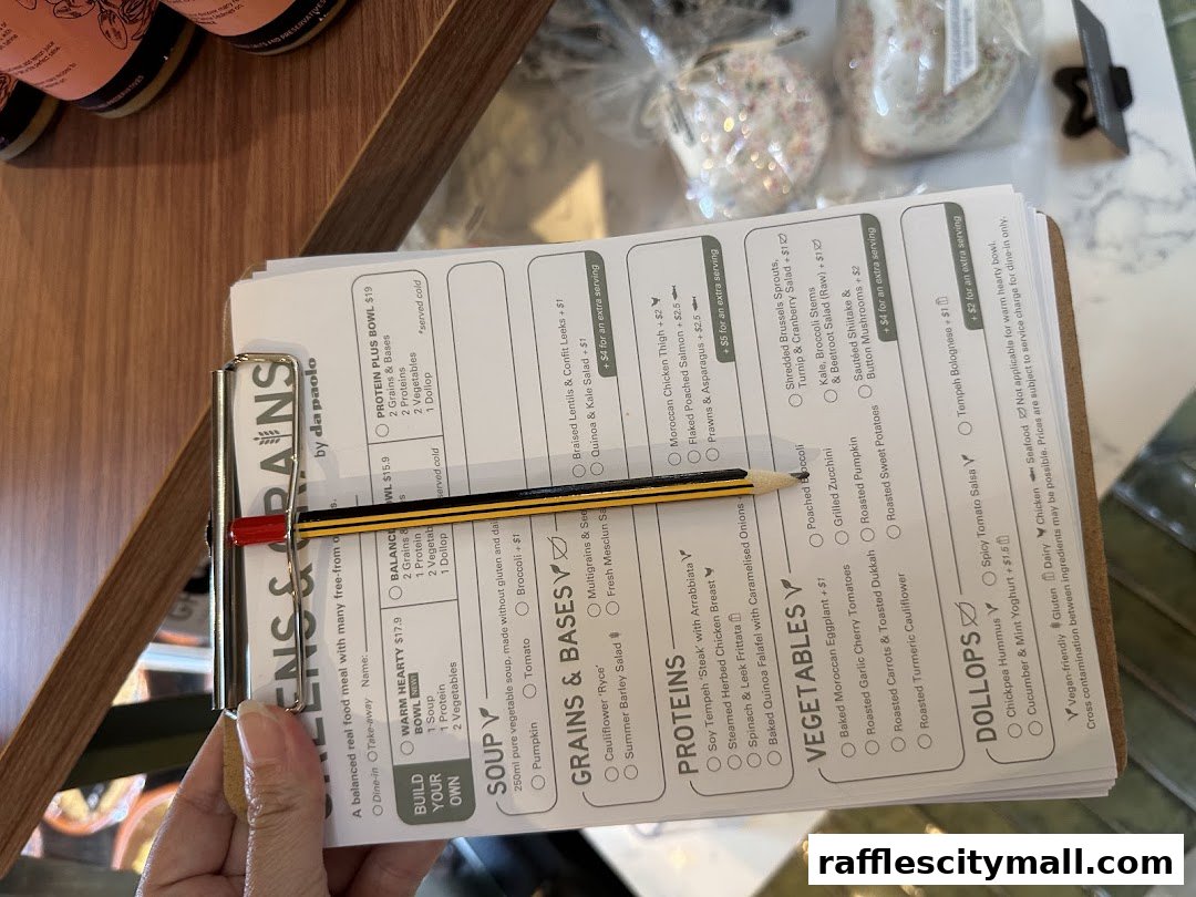 A close-up of a menu from Da Paolo Gastronomia, featuring build-your-own bowls and various protein and vegetable options.