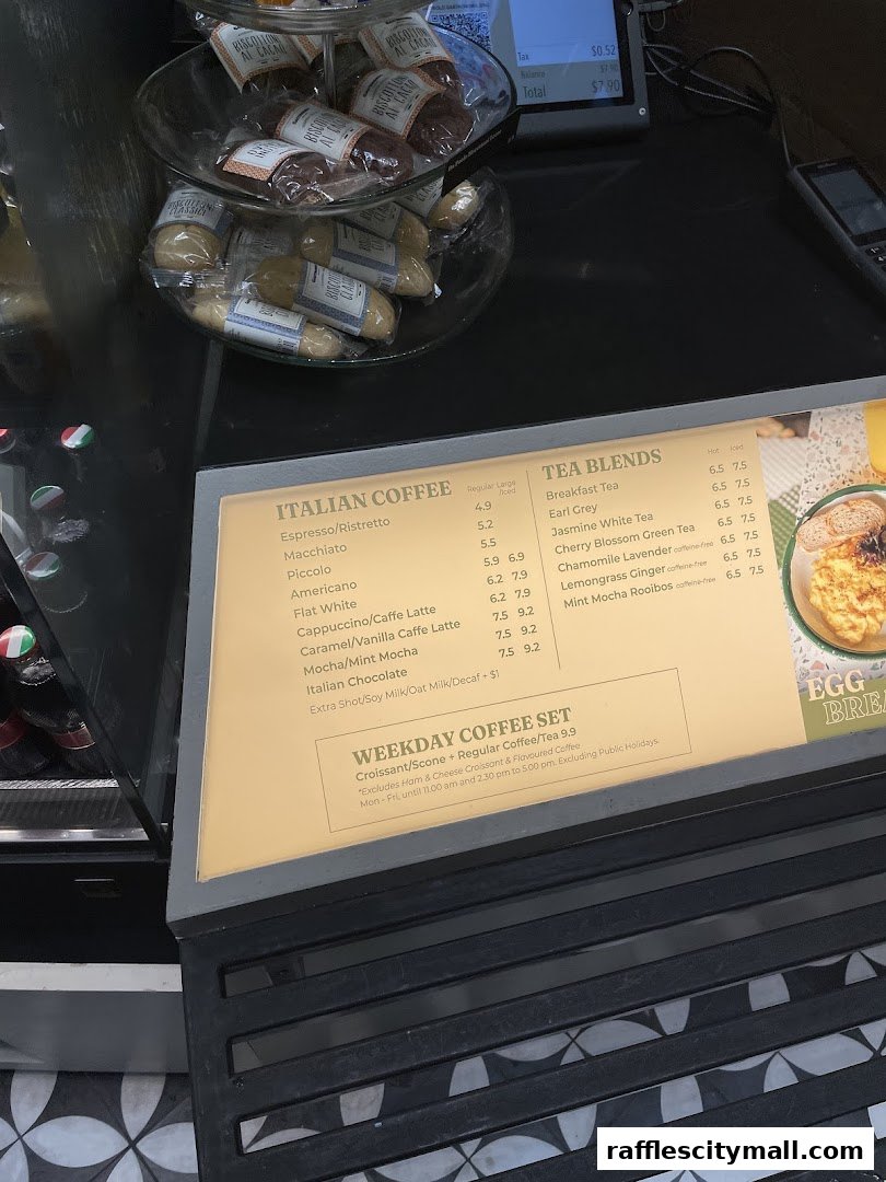 A menu board displaying Italian coffee and tea blends, with a weekday coffee set offer.