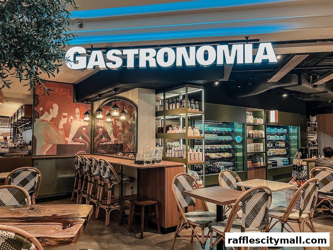 Interior of Da Paolo Gastronomia with seating, display shelves, and a large sign.
