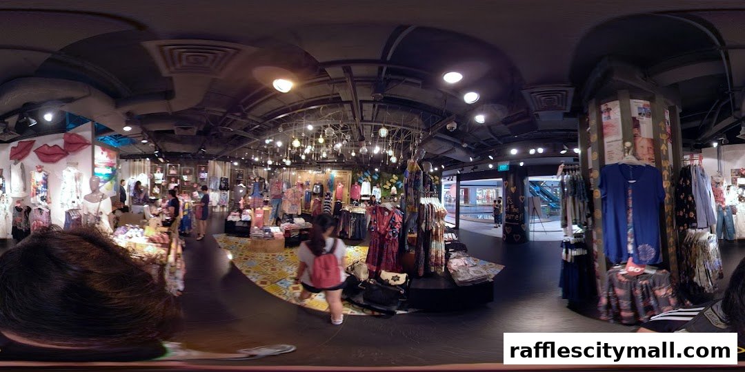 Interior view of a Desigual store showcasing colorful clothing on racks and mannequins.