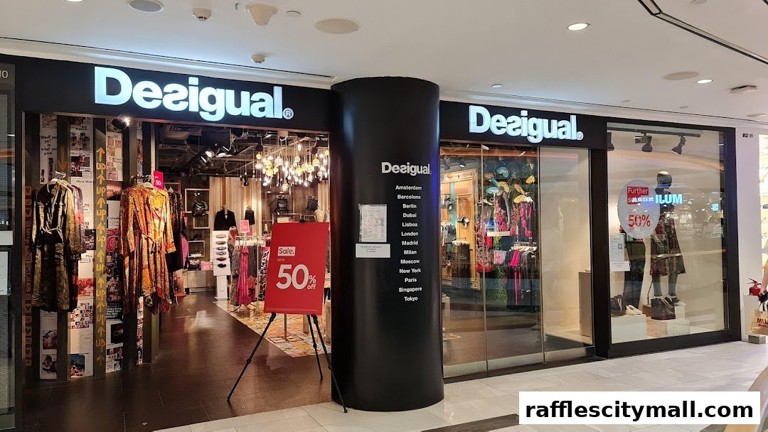 The Desigual store features vibrant clothing displays and a prominent 50% off sale sign.