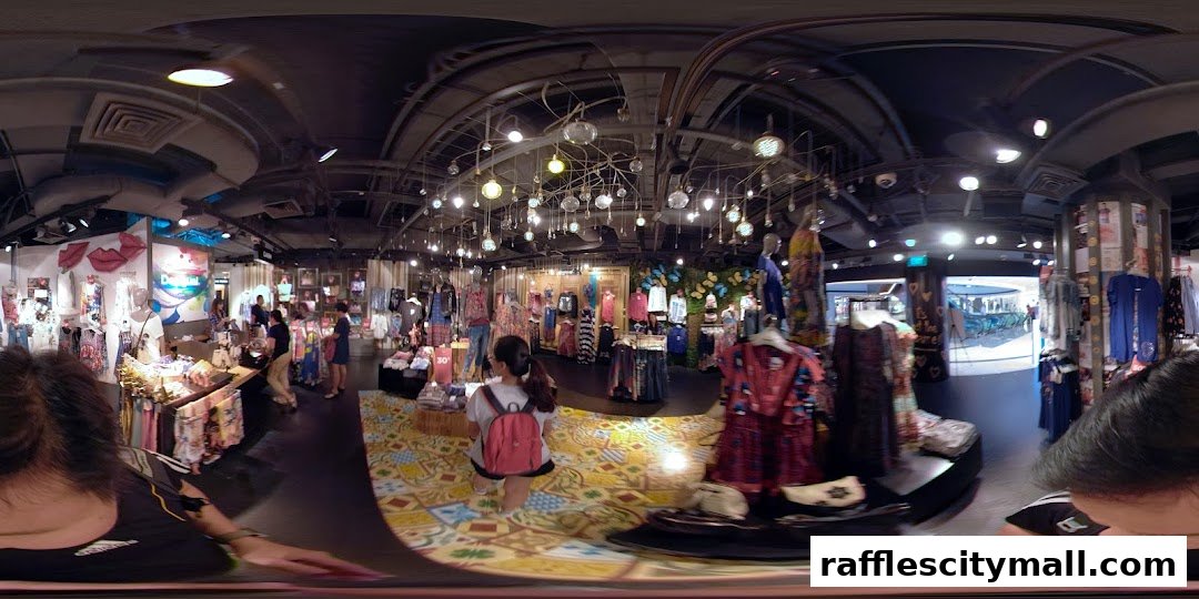 Interior view of a Desigual clothing store with colorful displays and mannequins.
