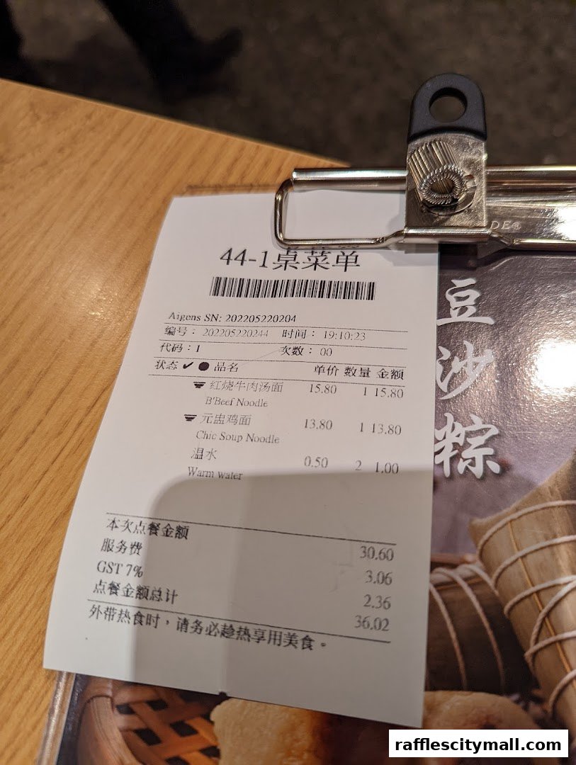 A close-up of a restaurant receipt showing food items and their prices.