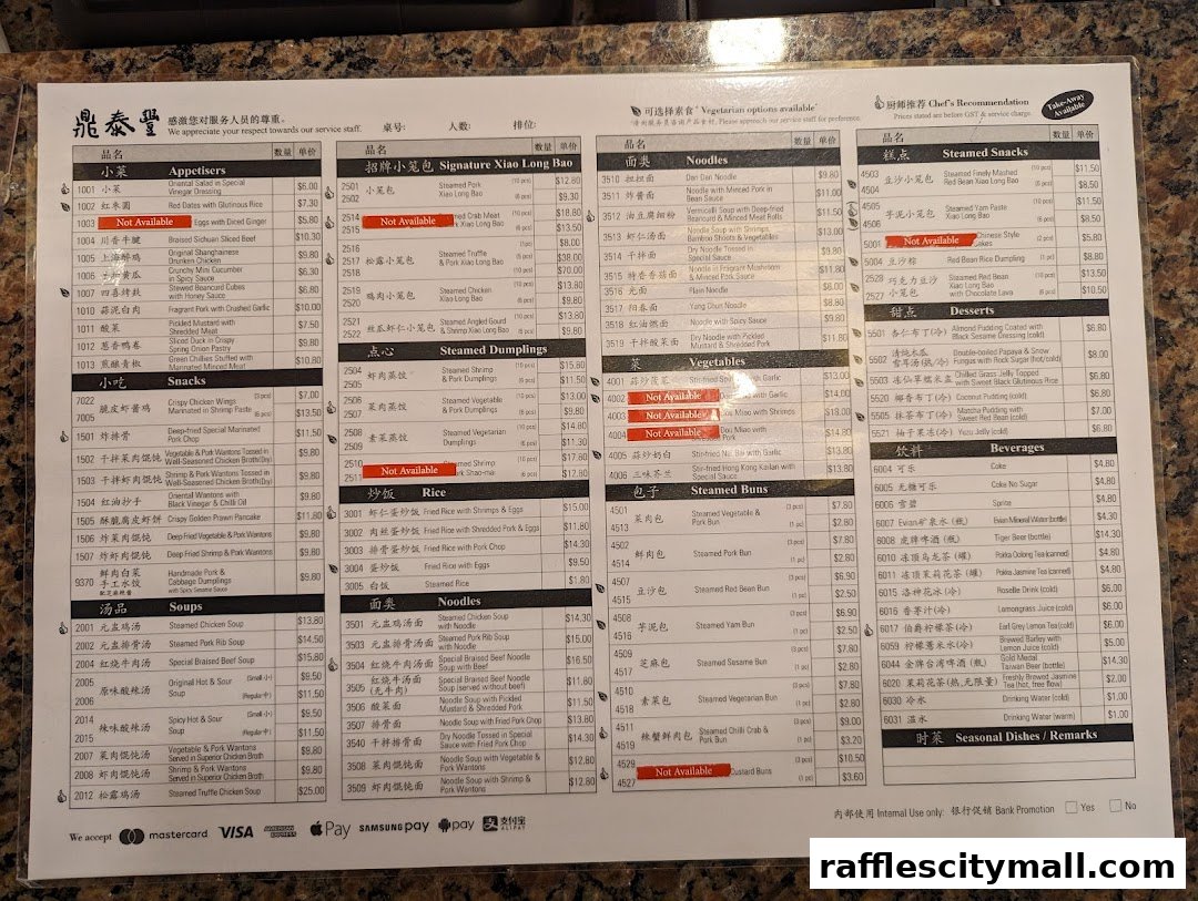 A menu from Din Tai Fung featuring various Chinese dishes, including dumplings, noodles, and snacks.