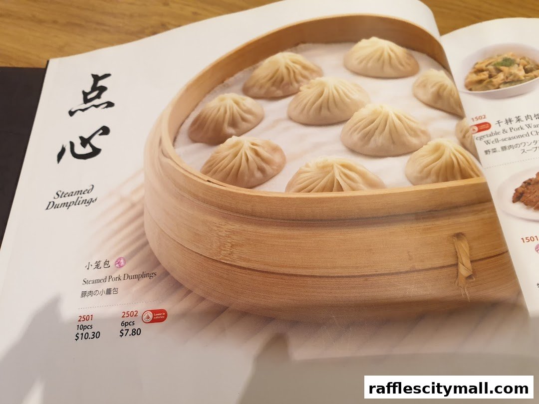 A menu featuring steamed pork dumplings in a bamboo steamer and other dishes.