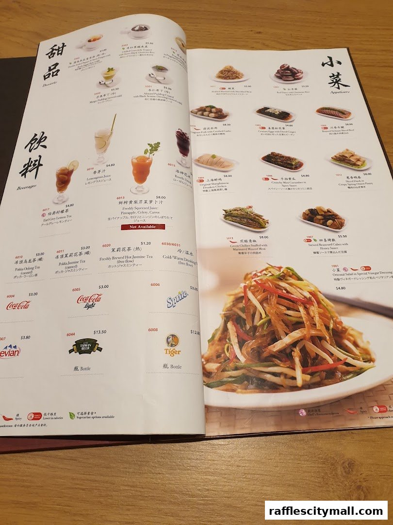 A menu from Din Tai Fung featuring desserts, beverages, and appetizers with food photography.