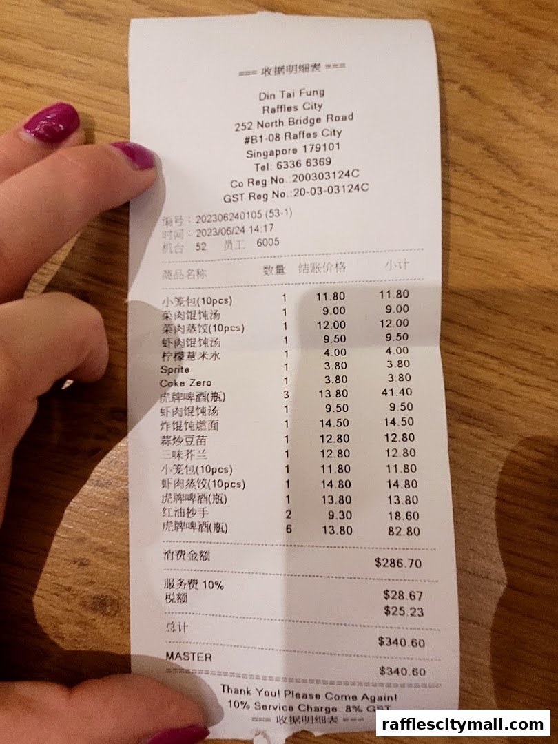 A receipt from Din Tai Fung Raffles City showing a list of food items and their prices.