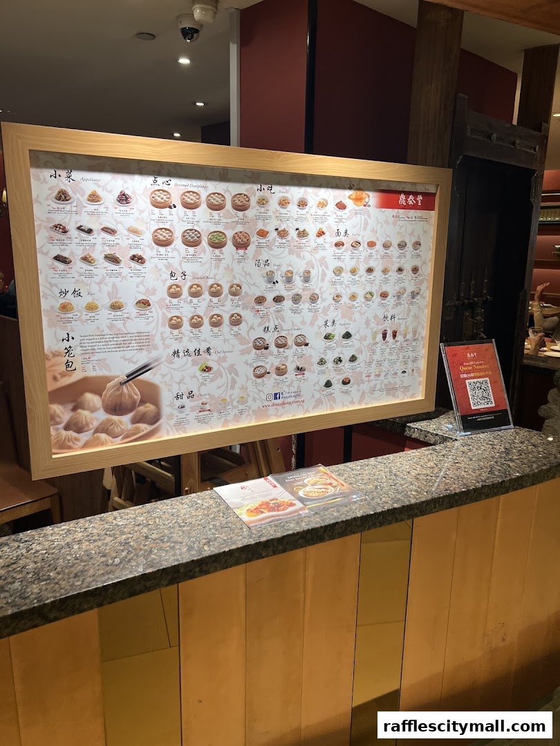 A large menu board displaying various Chinese dishes with pictures and text.