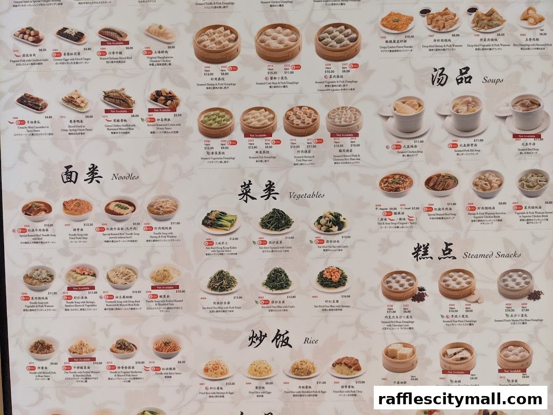 A menu from Din Tai Fung featuring various dumplings, noodles, soups, vegetables, rice dishes, and steamed snacks.