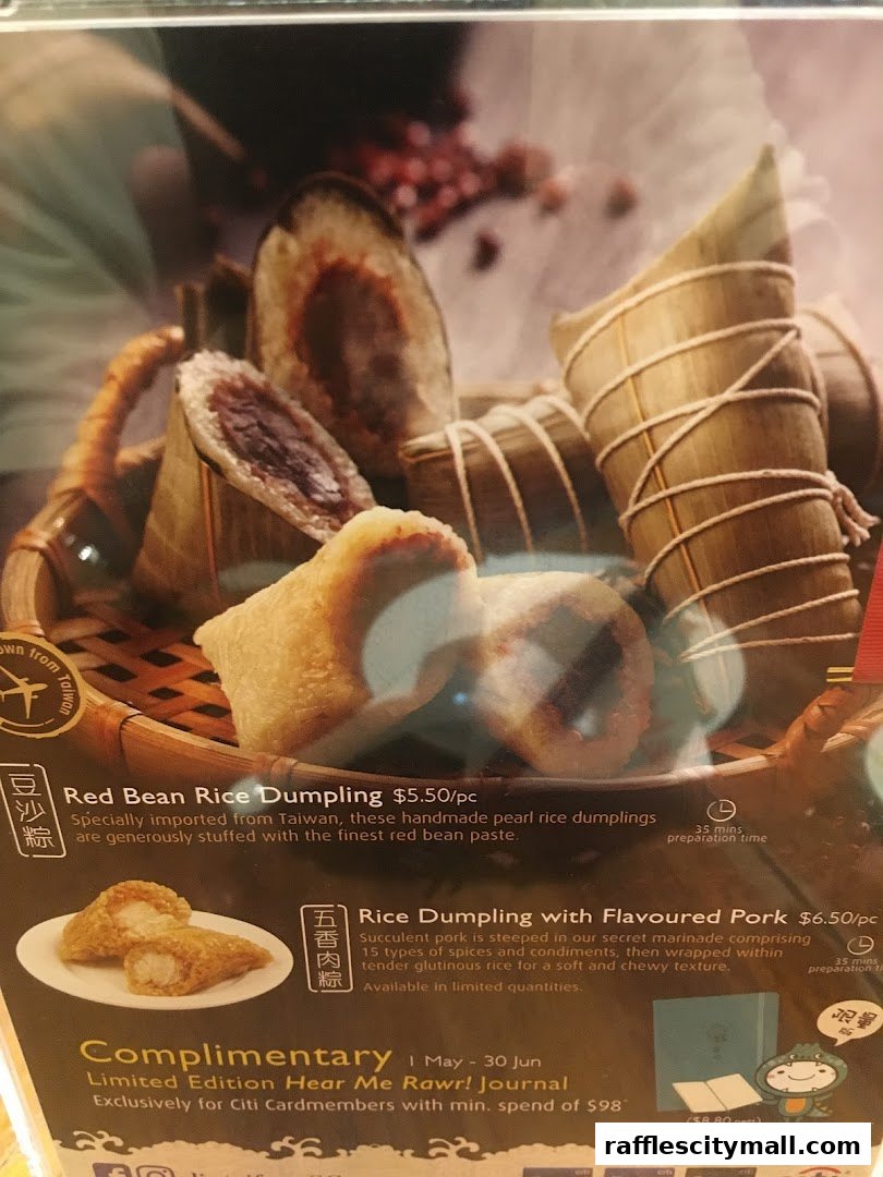 A close-up of two types of rice dumplings, one with red bean and another with flavored pork.