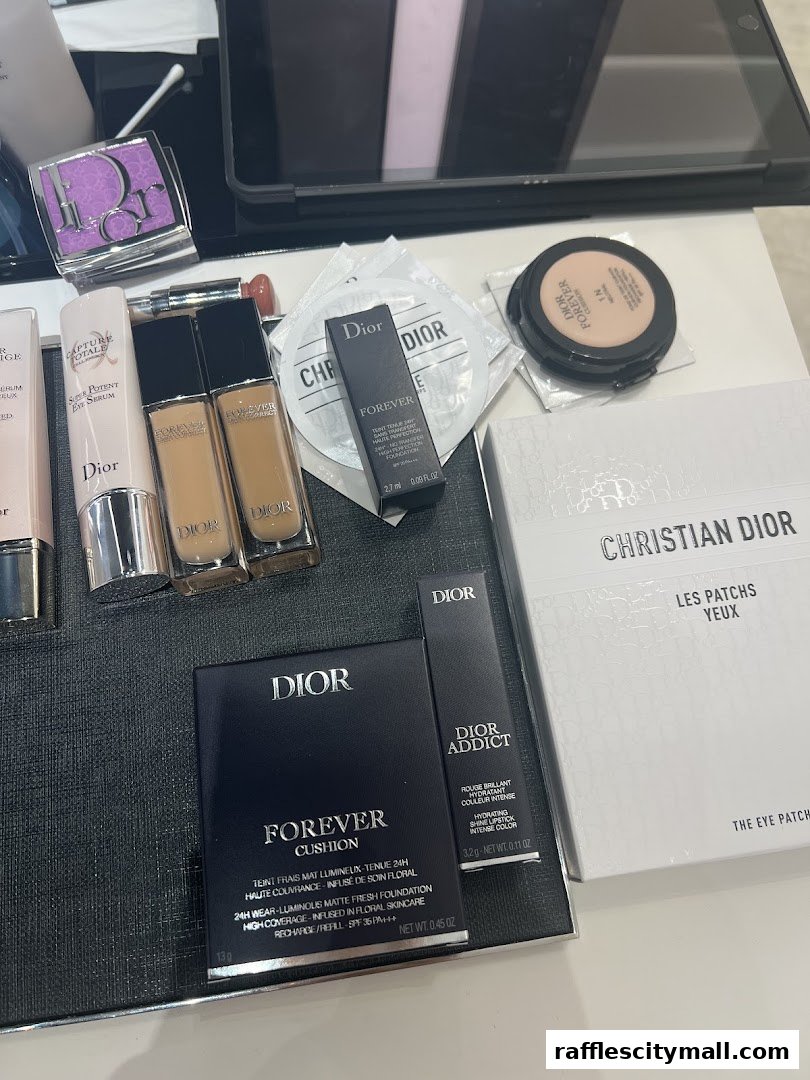 A collection of Dior beauty products including foundation, eye serum, and eye patches.