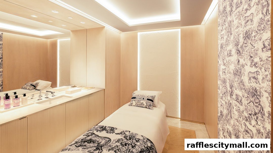 Luxurious Dior Beauty treatment room with a massage bed, vanity, and elegant decor.