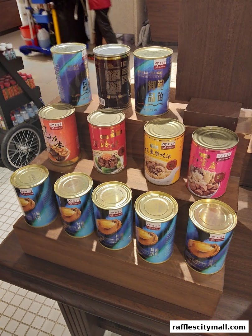 Canned abalone and other delicacies are displayed on wooden shelves in a retail store.
