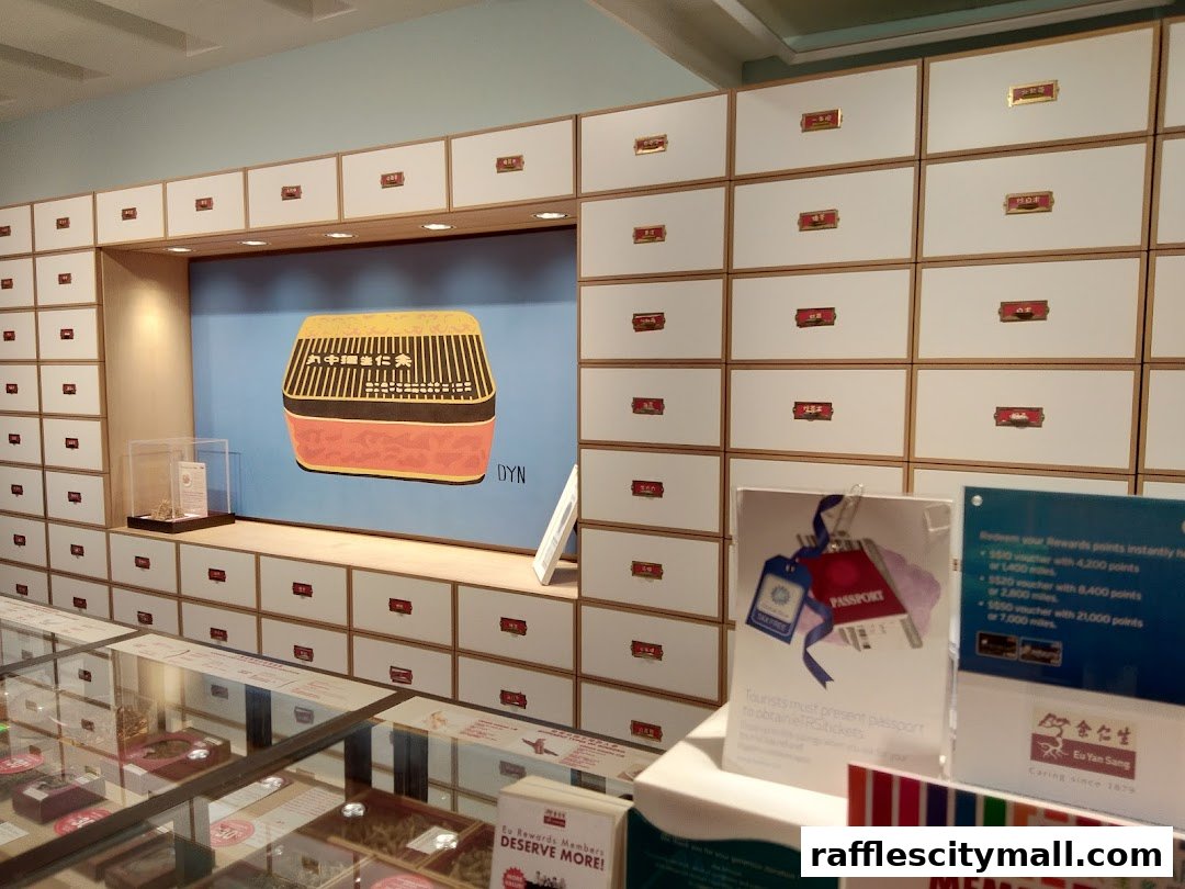 Interior of a Eu Yan Sang shop with many drawers and a display of products.