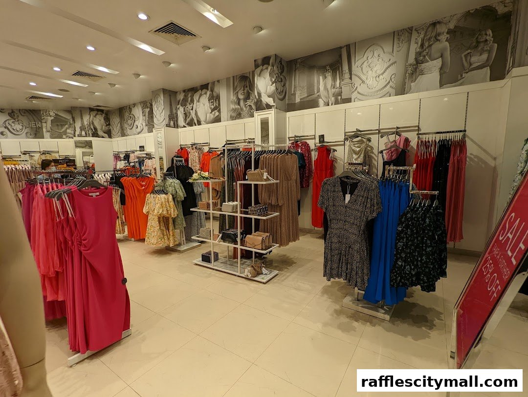 Interior view of a Forever New clothing store showcasing dresses and accessories.