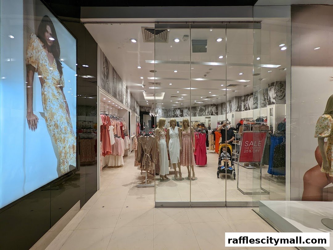The entrance of Forever New Raffles City, showcasing dresses and a sale sign.
