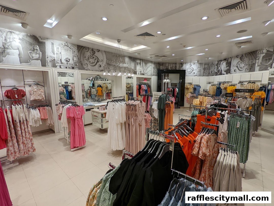 Interior view of a well-lit clothing store with racks of dresses and apparel.