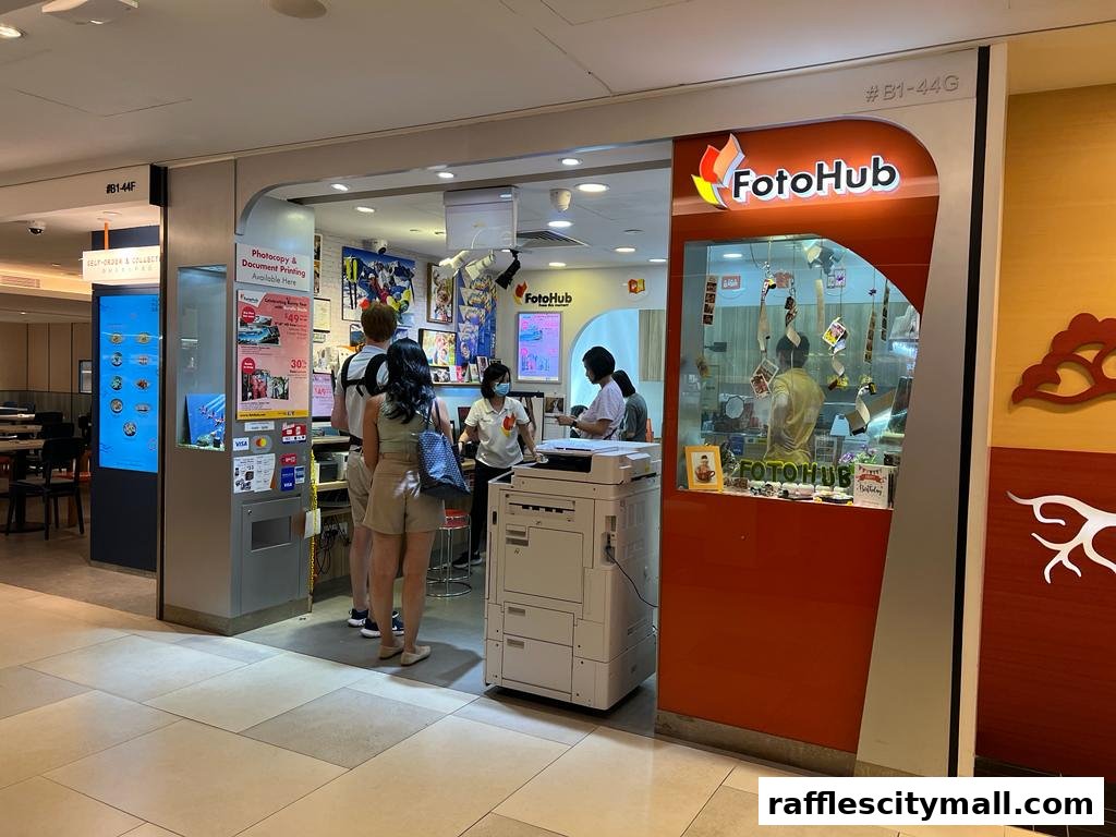 FotoHub shop front offering photocopy and document printing services with customers at the counter.