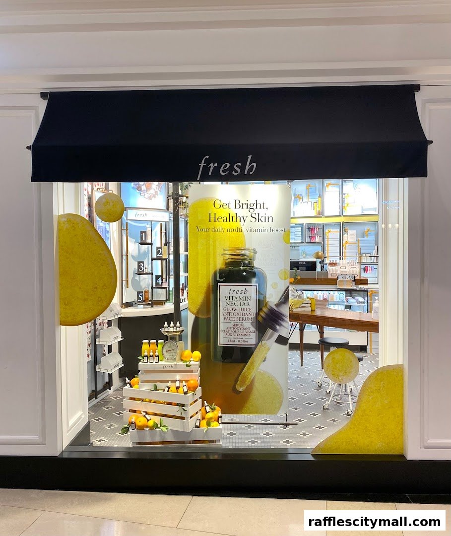 A shop window display featuring Fresh skincare products with a citrus theme.