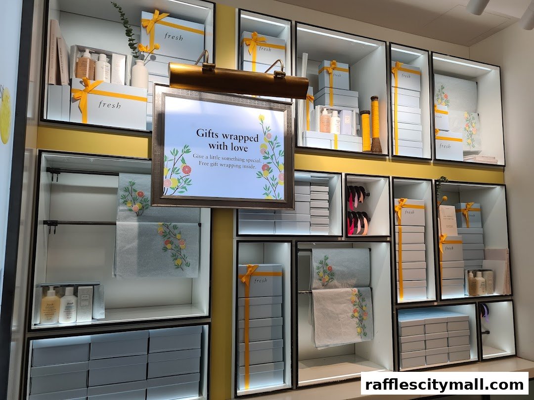 A retail display showcasing gift boxes and skincare products from Fresh.